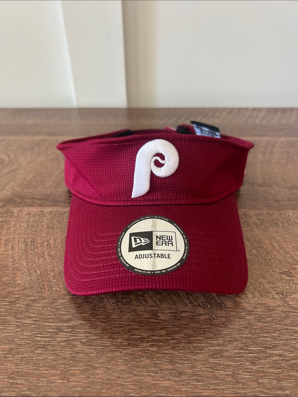 Phillies Visor. New Era Burgundy Visor with White Phillies Logo